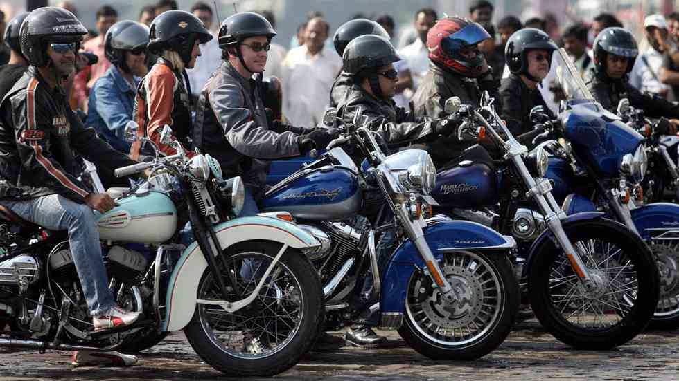 Employees of Harley Davidson and biking enthusiasts prepare to ride during a promotional event in Mumbai