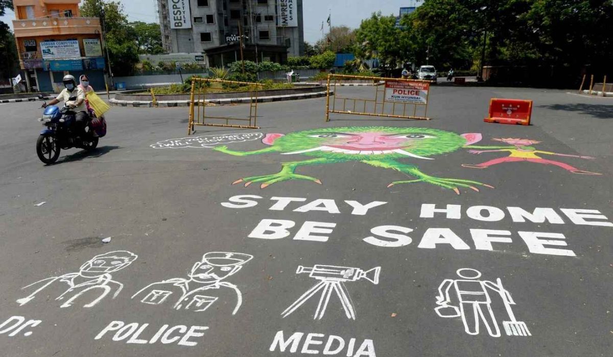 A motorist rides past an awareness graffiti reading ‘Stay home be safe’, during a government-imposed nationwide lockdown as a preventive measure against the coronavirus in Chennai.