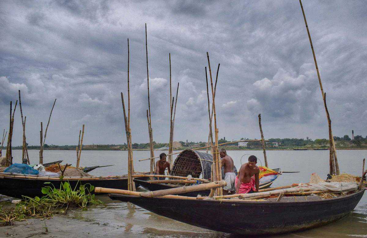 Fisherman anchoring their boats in Hooghly river in West Bengal ahead on Cyclone Amphan