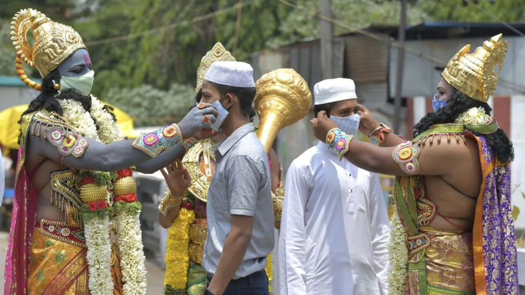 Actors dressed as deities from the Ramayana distribute face masks to members of the public at a Covid-19 awareness campaign on the occasion of Ram Navami, in Bengaluru, on April 21.