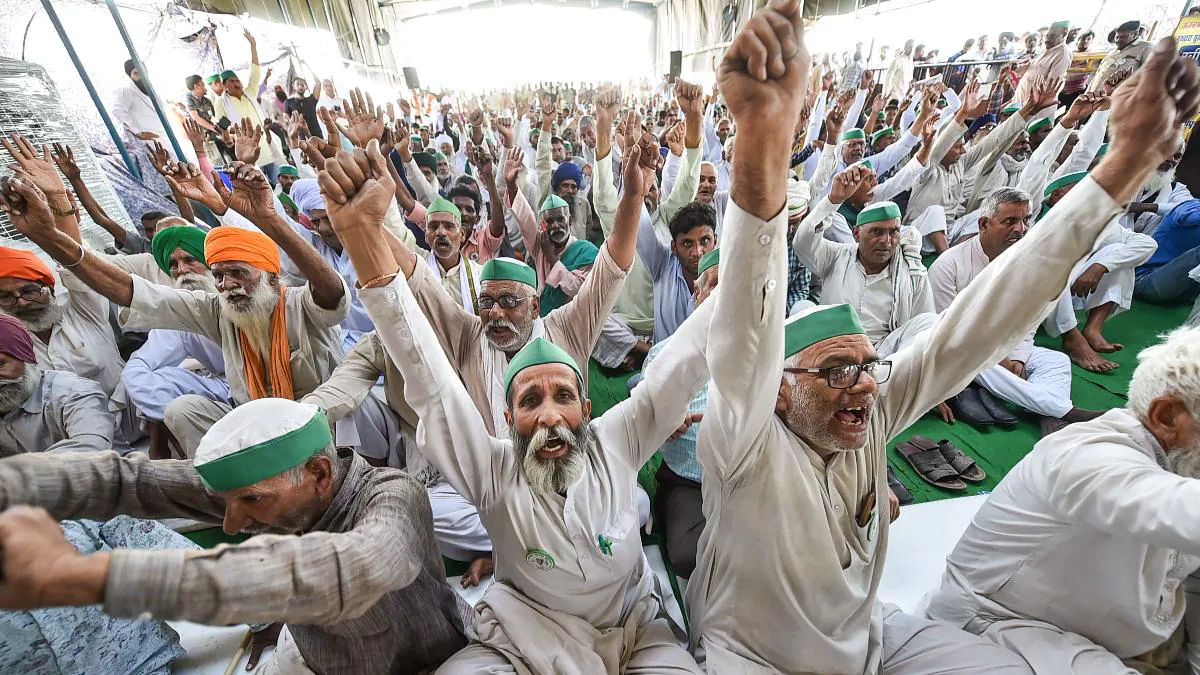 Farmers raise slogans during a panchayat on the National Highway-9, near Ghazipur in New Delhi.